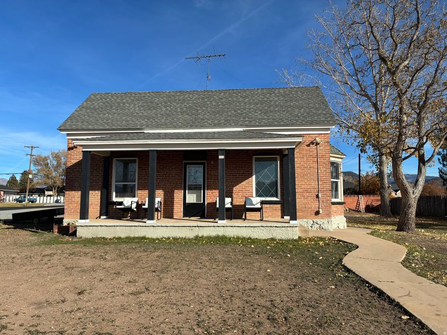 Beautifully renovated 1901 historic home featuring a classic brick faade and inviting front porch. Cozy interior with modern updates and most furnishings included. Situated on 0.24 acres with a 300 sq ft cellar with indoor access for storage or hobbies. Move-in ready charm!
