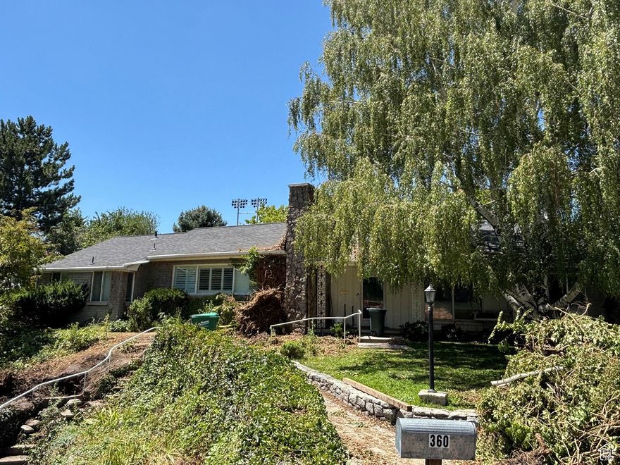 Location, location, location! Beautiful and secluded house on over half an acre, yet close to everything BYU has to offer. Enjoy rental income with an ADU over the garage. The home has wonderful bones and is ready for someone to add their own personal touch. Parcel # 20:068:0031, a .19 lot, is also included in the sale. Square footage figures are provided as a courtesy estimate only and were obtained from county records .  Buyer is advised to obtain an independent measurement.