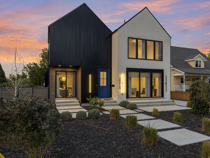 Rare opportunity to own a sophisticated, newly built residence in the highly sought-after East Millcreek area with a 4-car garage and a home theater room! Built in 2022, this exceptional home seamlessly combines smart design, premium finishes, and a prime location. The eye-catching exterior features expansive windows, crisp white stucco, architectural metal roofing, and contemporary metal accents. A thoughtfully landscaped front yard leads to a welcoming entry patio and custom front door, setting the stage for the elegance within. Inside, the home offers an abundance of natural light and a warm, open ambiance highlighted by exposed beams, soaring ceilings, oversized doors, designer lighting, modern iron railings, and rich hardwood flooring. The versatile layout includes 6 bedrooms, 5 bathrooms, a formal living room or den, spacious great room, mudroom, open loft, home theater, recreation room, and an oversized 4-car garage. The kitchen is a culinary showpiece with a generous center island, top-of-the-line stainless steel appliances, gas range, double ovens, custom tile backsplash, floating shelves, waterfall-edge quartz countertops, statement pendant lights, and abundant custom cabinetry. A full-size refrigerator is included. The adjacent butler's pantry offers extra prep space and storage-perfect for entertaining. Dine casually at the island or in the inviting dining area. The adjacent great room is designed for gathering, centered around a gas fireplace with a dramatic tile surround, and enhanced by expansive windows and a built-in bar area. From here, step outside to enjoy a private patio and fully fenced backyard complete with an in-ground trampoline-ideal for relaxation or play. Upstairs, the airy loft provides flexible space for a home office, playroom, or lounge and opens to a private deck. The serene primary suite offers a spa-inspired retreat with built-in cabinetry, dual vanities, a deep soaking tub, and a spacious walk-in shower. The fully finished basement continues the home's versatility with high ceilings and multiple living zones, including a home theater, recreation area, plumbing for a future wet bar, two bedrooms, a large Jack-and-Jill bathroom with a steam shower, and cleverly hidden storage rooms tucked behind built-in bookcases. Constructed with premium upgrades, this home includes 2x6 framing, blown-in insulation in both walls and floors, two high-efficiency furnaces, a humidifier, dual A/C units, a tankless water heater, casement windows, recessed lighting, a smart thermostat, and ceiling fans throughout. The attached 4-car garage includes a convenient faucet for car washing, a MyQ smart door system, an EV charging outlet, and ample room for storing gear, bikes, or other equipment. All of this, located just minutes from downtown Salt Lake City, the University of Utah, top-rated schools, shopping, dining, parks, Millcreek Common and world-class ski resorts. Experience luxury, comfort, and location-all in one extraordinary home.