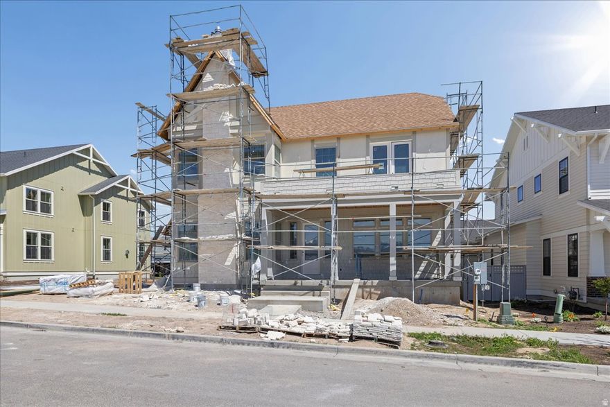 Popular Clermont Tudor floorplan by Daybreak's luxury builder blends modern function with timeless Tudor charm in Daybreak's Watermark Village. An open-concept layout flows from a large great room to the chef-ready kitchen-perfect for entertaining-while a cozy sitting room with a fireplace offers winter evenings by the fire. The luxury primary suite features a private balcony with mountain views and an oversized closet. Finishes include a finished basement with rough-in for a future wet bar, a 4-car tandem garage, and full landscaping front and back. The Clermont Tudor delivers fantastic curb appeal and is designed to meet the needs of just about any family. Call today to set up a time to show this charming home.