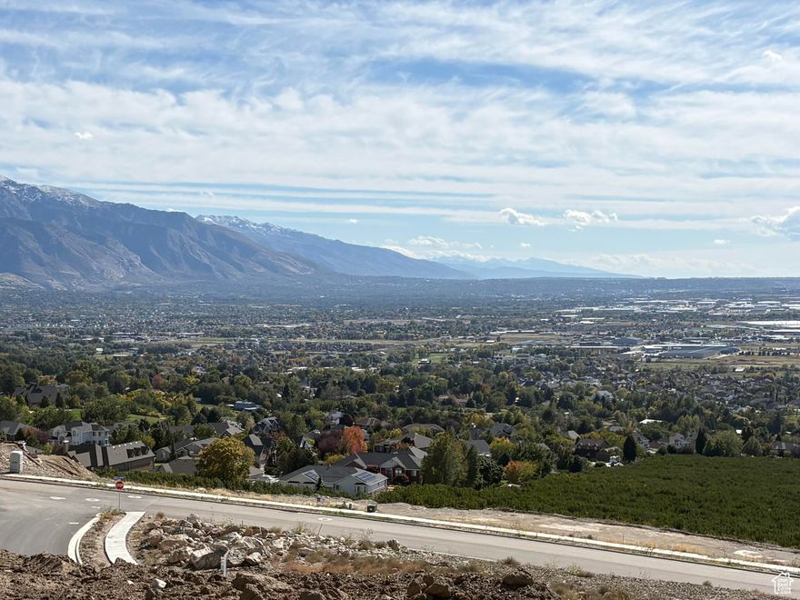 Nestled High on the Beautiful Pleasant View Bench, this stunning 0.40-Acre lot showcases sweeping Mountain and valley views along with breathtaking sunsets. The property offers the perfect setting for a custom home designed to highlight the area's natural beauty and serene surroundings. Enjoy the peaceful atmosphere while being just minutes away from hiking trails, skiing, parks, and local conveniences. this rare view lot provides an exceptional opportunity to build your dream home in one of Pleasant View's most desirable locations.