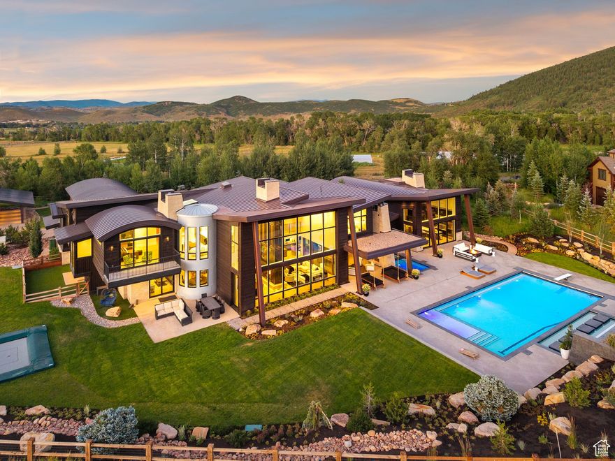 Experience a 4.25 acre estate on par with the finest homes in The Colony or Deer Valley, ideally situated in one of Park City's most coveted year-round neighborhoods. Sweeping mountain views, stunning finishes, smart home technology, & incredible indoor-outdoor living with an expansive patio, pool, & hot tub-perfect for entertaining.