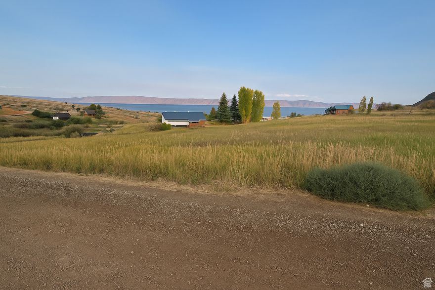 Excellent sloping lot with great access, located in the desirable Bear Lake West community. Amenities include a swimming pool, hot tub, tennis courts, and private beach access.  Enjoy boating, fishing, and water sports on Bear Lake in the summer, plus nearby public riding and hiking trails. Winter brings endless snowmobiling and other outdoor activities.  The perfect spot to build your dream retreat and take full advantage of everything Bear Lake has to offer.  Information deemed reliable, buyer to verify information.  Seller is now including a complete set of engineered building plans with the sale, giving you a head start on construction and saving valuable time in the building process.