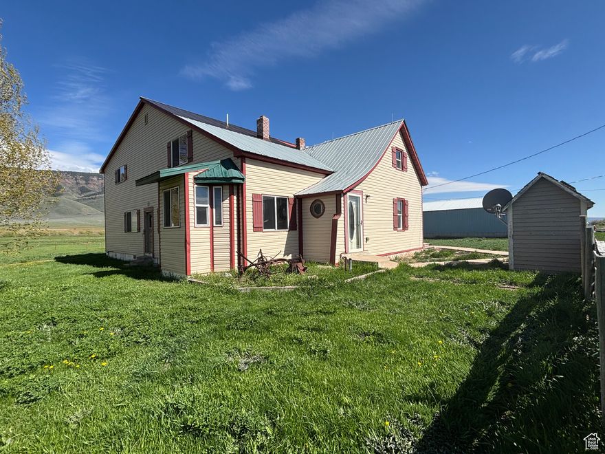 PRICE REDUCED!! Beautifully renovated 1900's farmhouse with a huge addition in 2015 located in the quiet farm town of Geneva, Idaho! Situated perfectly between Bear Lake and Star Valley, both big recreational hot spots. Outstanding rugged mountain views from all around the property. This adorable farmhouse has all the charm from the 1900s with a bay window, crown molding, and original log accent wall plus the space and updates of a home this century. It features a beautiful big open kitchen with tons of upper and lower cabinets, ample countertop space, new dishwasher, oven, and microwave, and a separate gas range. The kitchen is open to the great room that boasts the original log exterior as an accent wall. The great room has exposed log accent support beams and cedar wainscoting throughout. The main level has a separate formal living room with bay window, one bedroom (with full en suite bathroom), an office or 6th bedroom (no closet), great room, kitchen, laundry/mudroom, formal dining room, and an open kitchen floor plan. There are 4 bedrooms and 2 full baths upstairs. Tons of storage and cute library/book nook. Of the 4 bedrooms upstairs, one is the massive primary bedroom with a huge walk-in closet, separate, large "shoe closet", and sizeable primary en suite bathroom. This property is 1 full acre with amazing mountain views, and is newly fenced on 3 sides. There is a HUGE shop/barn with power with a framed corner for chickens. Lot has tons of space for animals and gardens. New fiber optic connected to home! And septic tank just pumped and inspected. Make your country dream a reality! Square footage figures are provided as a courtesy estimate only. Buyer is advised to obtain an independent measurement. There is some mild TLC to do in the form of small areas to paint, some flooring replacement, etc, but price is right to allow for it! Come tour it today!!