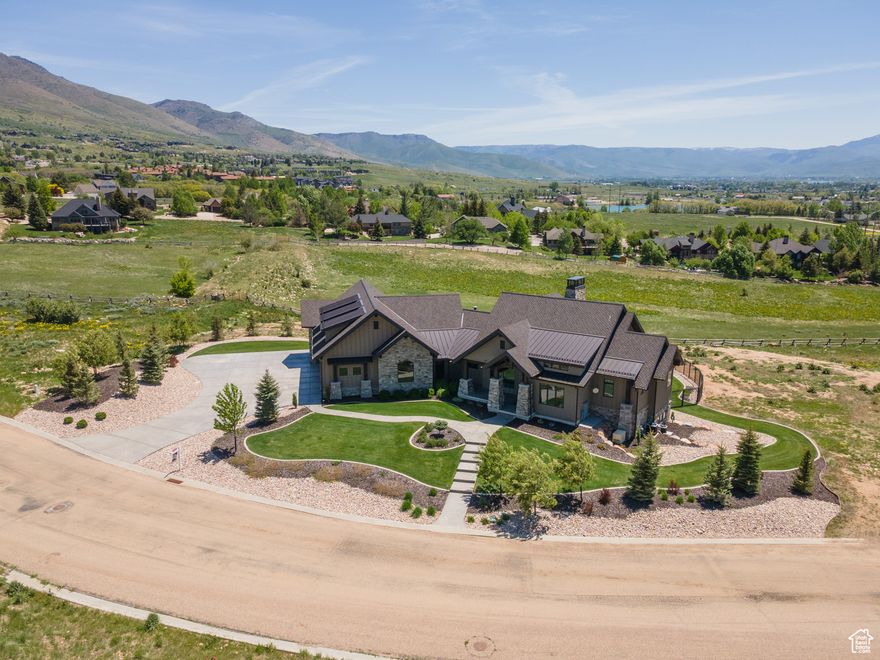 Large Price Improvement. This extraordinary luxury home on 1.17 acre offers an unmatched blend of comfort, convenience, and elegance. Perched to capture stunning Ogden Valley and Pineview Reservoir views, and just minutes from 3 world class ski resorts, Pineview reservoir, Wolf Creek golf course, and miles of hiking/biking trails make this home is the ultimate in mountain living. SLC International Airport is only 55 minutes from the front door. Built on two spacious lots in the Eagle Ridge community, the property is bordered on two sides with land that is set aside as natural habitat for wildlife. This residence boasts the finest finishes throughout, including premium Wolf and Sub-Zero appliances, whole-home audio system, a high-end programmable lighting system, automatic backup power generator, heated driveway, and many other extras. Short term rentals NOT allowed in this neighborhood. The property features an impressive 1,818 sq. ft. indoor climate controlled sport court (included in square footage listed) perfect for year round pickleball and basketball.