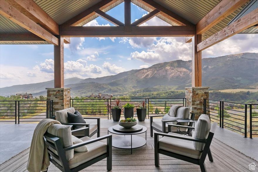 Tucked into the quiet enclave of Durfee Creek Estates, this five bed, five bath mountain retreat balances elegance, function, and the beauty of Ogden Valley's surroundings. With 1.21 acres of privacy backing forested open space, the home embraces its Wasatch Mountain setting in every season-snowy peaks, golden aspens, or lush summer greenery. Inside, natural light floods the great room through expansive windows that frame uninterrupted views of North Fork. Beautiful 7.5" wide plank engineered wood floors anchor the living spaces, while the chef's kitchen, with quartz countertops and a butler pantry, flows seamlessly to a covered deck-perfect for gathering, dining, or simply soaking in the view. The primary suite offers a spa-like escape with a luxurious steam shower, while the walk-out lower level adds versatility with its own kitchenette-ideal for guests or extended family. Practical luxury defines the home with a heated garage featuring an epoxy floor, whole-house water filtration, surge protector, backup generator, and heat tape. A durable metal roof and oversized garage ensure lasting comfort and peace of mind. Outdoors, covered patios and low-maintenance landscaping extend living into the mountain air. Facing the Wasatch Mountains, this retreat also includes the option to expand: the neighboring 1.4-acre lot, available with engineered plans and a Liberty Pipeline C share. Minutes from world-class skiing, Pineview Reservoir, and endless trails, this home is where mountain serenity and year-round adventure meet in perfect harmony. All property information, boundaries and documents to be verified by buyer.