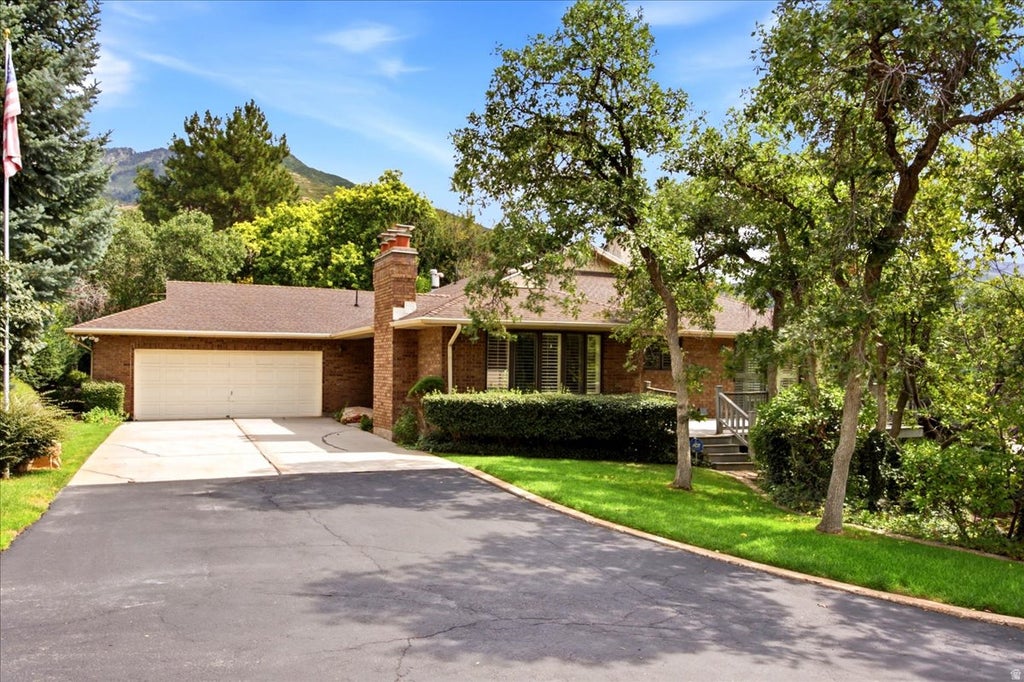 Photo of 1802 WHISPERING OAKS DR, Ogden, UT 84403 (MLS # 2182806)