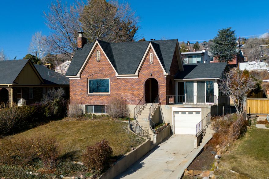 Adorable Tudor on 10th ave. Amazing views of the valley, terraced backyard with covered parking. Enjoy the views from your sunroom above the garage or from your large covered porch.