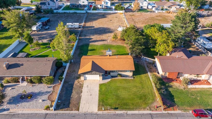Never before on the market HORSE PROPERTY, being sold by the original owners!  Have the comforts of being close to everything that the city offers, yet when you get home you can escape from it all with in this quiet horse property!  Perfect for homesteading within the city. Conveniently located with quick easy access to the I-15. New kitchen within the last couple years, roof less than 10 years old, Parking for all your toys with endless possibilities!  Home is being sold as is.