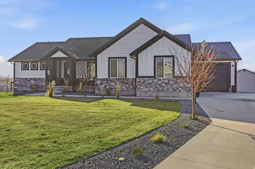 This custom home is tucked away at the back of a subdivision. Enjoy a fully landscaped yard with flat land beyond the fenced area-ideal for horses, a shop, or future possibilities. The extra-large garage offers tons of storage, while a stunning 4-panel sliding door creates seamless indoor-outdoor living. Cozy up by one of two fireplaces, and appreciate the thoughtful Costco door that makes unloading groceries a breeze. A truly amazing property offering space, comfort, and convenience.