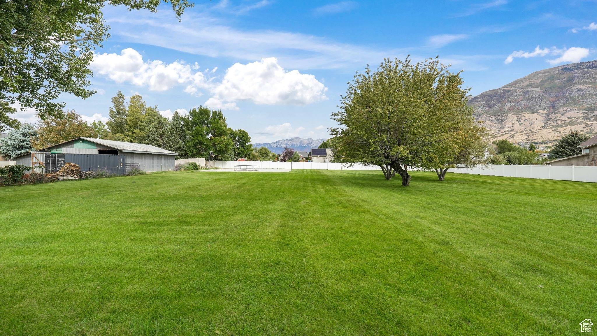 Charming home on 1.03 acre in Pleasant Grove with breathtaking views of Mt. Timpanogos and Alpine Canyon. Fully remodeled in 2014, this home offers four spacious bedrooms and two baths, including a spacious primary suite with a walk in closet and ensuite bath. The kitchen is beautifully appointed with custom cabinetry, granite countertops and a stylish backsplash. The backyard is a dream featuring a sprawling deck perfect for gatherings, mature shade trees, and a full auto sprinkler system to keep the grounds lush. Adding to the appeal is a 45 X 55 basketball court and pickleball court, creating the perfect setting. Property is zoned R-R which allows for animal rights.