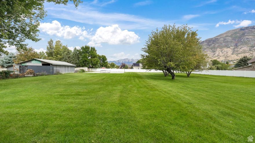 Charming home on 1.03 acre in Pleasant Grove with breathtaking views of Mt. Timpanogos and Alpine Canyon. Fully remodeled in 2014, this home offers four spacious bedrooms and two baths, including  a spacious primary suite with a walk in closet and ensuite bath. The kitchen is beautifully appointed with custom cabinetry, granite countertops and a stylish backsplash. The backyard is a dream featuring a sprawling deck perfect for gatherings, mature shade trees, and a full auto sprinkler system to keep the grounds lush. Adding to the appeal is a 45 X 55 basketball court and pickleball court, creating the perfect setting. Property is zoned R-R which allows for animal rights.