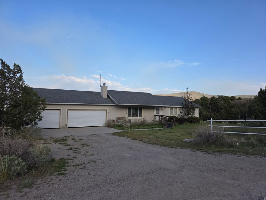 Rare Find!  This Herriman home has 5.66 acres of usable land. Exquistie Mountain and Valley views!  It features a 2800 sq. ft ramble with vaulted ceilings, 3 car garage, an unfinished walkout basement.   roof replaced in 2019.  It is accessed through Hi County Estates but is not part of Hi Country.  The property is being sold AS-IS.  Buyer to verify all.