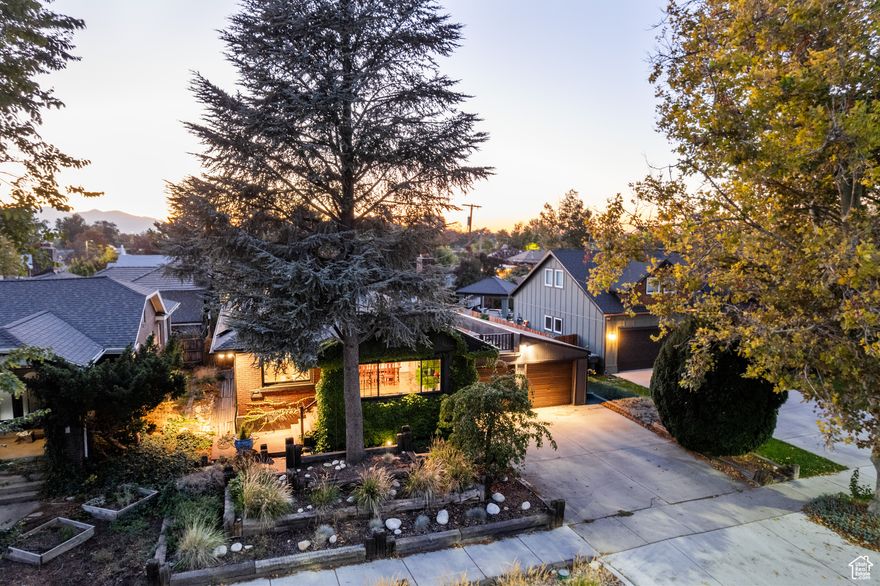 Welcome to 1848 South 500 East, a home that radiates warmth, light, and classic charm - perfectly situated in the heart of Sugar House, one of Salt Lake City's most beloved neighborhoods. Steps from vibrant cafs, boutique shops, and Liberty Park, this residence captures the essence of thoughtful living with an artful blend of history and modern comfort. Step through the marble entryway into sun-filled spaces framed by an abundance of large windows that bathe the home in natural light from morning to evening. The graceful atrium is a true retreat - an inviting space where you can sip your morning coffee gazing out over the private & charming backyard, creating a serene start to the day. Inside, hardwood and tile floors, custom stained-glass windows, and refined architectural details showcase the home's craftsmanship and enduring beauty. The finished basement adds a polished extension of living space, with newer ceilings, carpet, lighting, drywall, and paint, perfect for relaxing or entertaining. Thoughtful upgrades make this home as practical as it is beautiful: a new roof, paid-off solar panels, and an expanded two-car garage reimagined into a single spacious area with added beams and columns for both form and function. Outdoors, the home continues to delight with a front-yard zen garden, designed for peace and reflection, and a backyard deck and patio that invite gatherings under open skies. A charming chicken coop completes the setting - a nod to sustainable living in a modern, urban sanctuary.