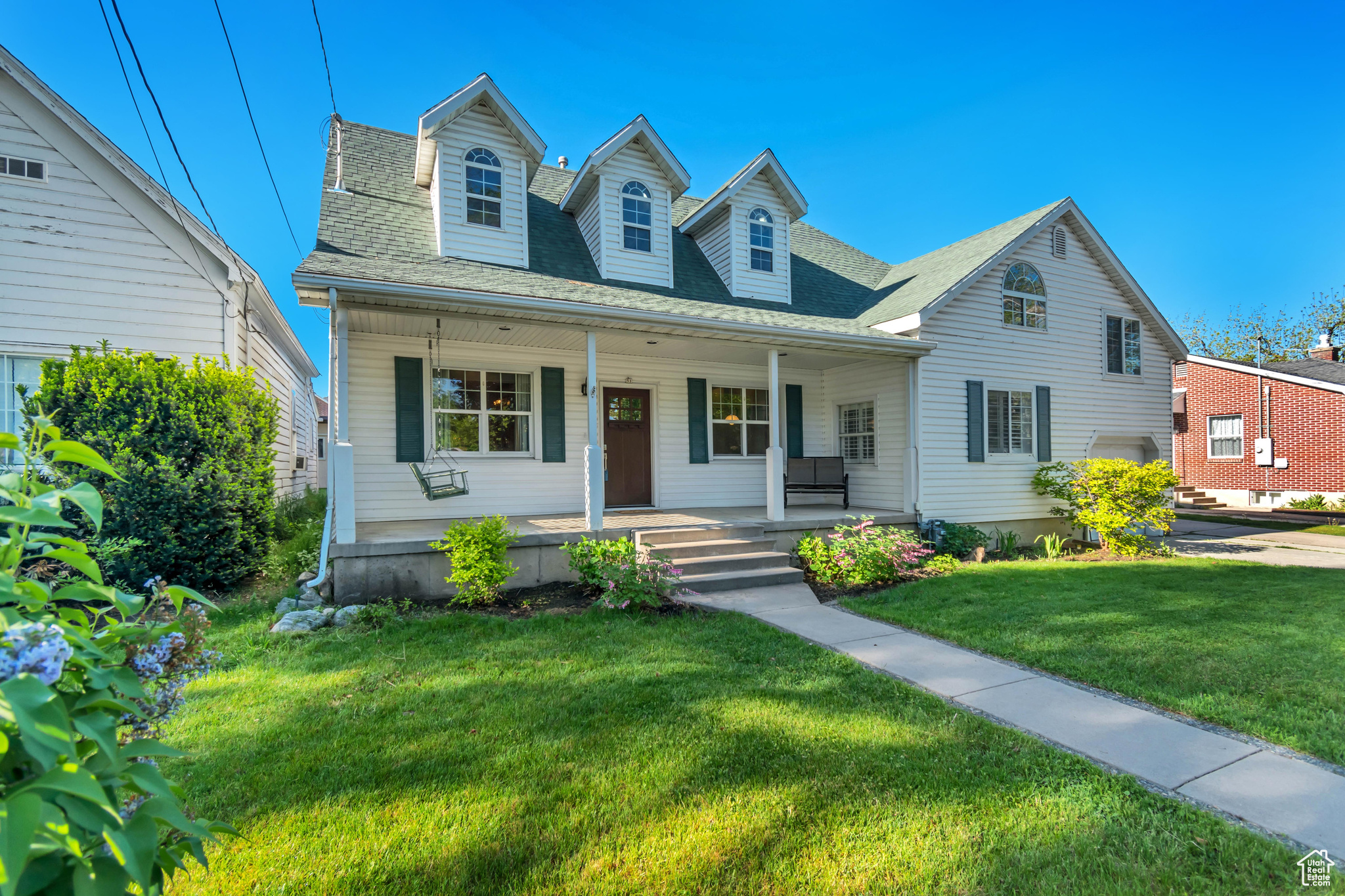 Charming Two-Story Home in the Heart of Farmington!  This delightful home offers the perfect blend of comfort and convenience. Features a large family room with a cozy gas fireplace, a generously sized laundry room with a utility sink and updated comforts including newer furnaces and central air. White picket fence in the front yard, large front porch w/ swing & inviting backyard w/ firepit. Gorgeous mountain views. Located just minutes from parks, schools, and the community swimming pool. Schedule your private showing today!