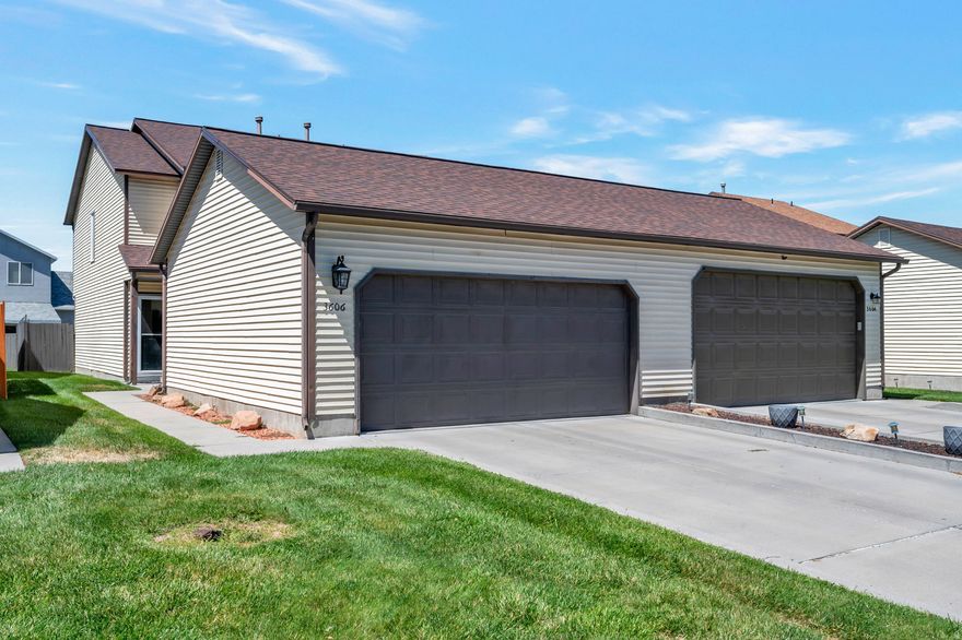 Updated townhome with brand new furnace and A/C. Beautifully upgraded kitchen, appliances, flooring, on demand water heater and newer roof. The back patio is fenced to keep your kids or dog safe. This home is close to the freeway and in a nice and quiet neighborhood. The big two car garage is roomy and clean. Low HOA fees and common RV parking for the neighborhood.  Come see your new home! Washer and dryer are negotiable.