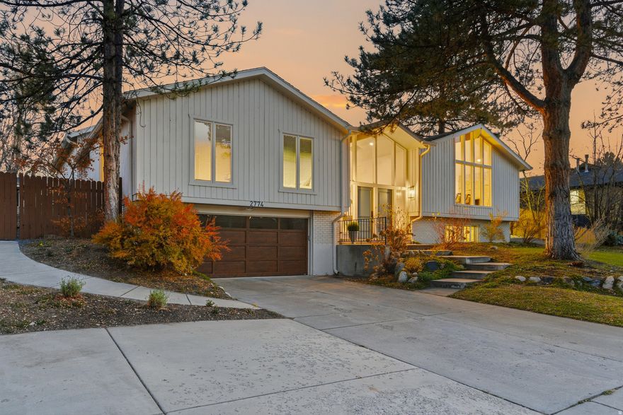 Beautifully remodeled home in the prestigious Willow Creek Country Club neighborhood! This spacious 7-bedroom, 4-bath residence combines modern updates with timeless design and high-quality finishes. The open, inviting floor plan features vaulted ceilings, new flooring, fresh designer paint, updated bathrooms, and elegant finishes that create a bright, sophisticated atmosphere ideal for both entertaining and everyday living. Upstairs offers 5 bedrooms, including a generous elevated primary suite with walkout to yard. The fully finished basement has 2 large bedrooms (which could also be additional family/craft rooms), a three-quarter bath, and a large family room with a bar/speakeasy area-perfect for movie nights, guests, or gatherings. ...possible mother-in-law apartment with the basement entrance. Step outside to your private backyard oasis, showcasing new landscaping, fruit trees and berries, an inviting spacious multi- level patio, with gas fire log and tranquil water feature that brings a sense of peace and relaxation-all set against a stunning mountain backdrop. Located just minutes from Willow Creek clubhouse, top-rated schools, ski resorts, parks, and shopping, this move-in-ready home offers comfort, convenience, and style in one of Sandy's most desirable neighborhoods.