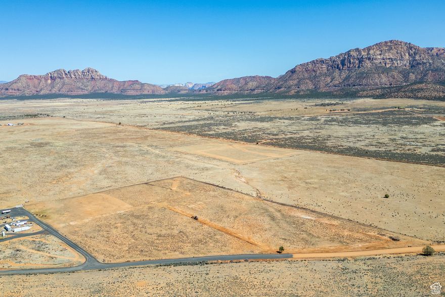 Escape to the serenity of Apple Valley with this stunning parcel just shy of 14 acres, offering wide-open space, breathtaking mountain views, and endless possibilities. Nestled in a peaceful and private setting, this expansive property is perfect for those seeking a quiet retreat with room to grow. Currently zonedAgriculturaland falling within theGreenbelt, this land offers significant potential for lower property taxes. Enjoy easy year-round access and the convenience of your very own private well already in place. With a successful closing, the seller is ready to bringpower and fiberdirectly to the lot-making it ready for your dream home, ranch, or recreational getaway. Marvel at the panoramic red rock vistas and star-filled skies at night, all while being just a short drive from local amenities, Zion National Park, and surrounding outdoor adventures.