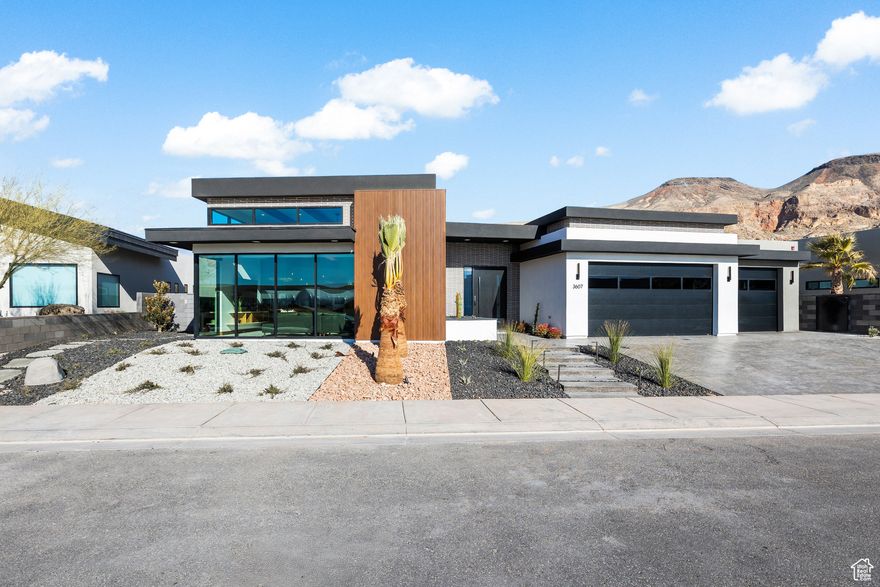 Introducing Kupferfelsen, translating to "Copper Rock," a fan favorite from the 2025 St. George Area Parade of Homes. This exquisite residence offers 6 spacious bedrooms and 6 luxurious bathrooms, thoughtfully designed within 4,155 sq ft of modern elegance. Each bedroom is complemented by its own ensuite, showcasing gorgeous design elements that blend contemporary trends with timeless sophistication. The stunning walnut cabinetry adds warmth and character, while the floor-to-ceiling windows invite abundant natural light and provide unobstructed views of the stunning golden Hurricane bluffs and the lush greenery of the 11th hole on the Copper Rock Champion Course. Whether you're looking for a stunning primary residence, a part-time getaway, or a lucrative investment opportunity, Kupferfelsen is ideal for short-term or weekly rentals. Experience the perfect blend of luxury, comfort, and scenic beauty in this remarkable property. Embrace the lifestyle you deserve at Kupferfelsen, where every detail is crafted for both relaxation and entertainment. Don't miss your chance to make this dream home your own!