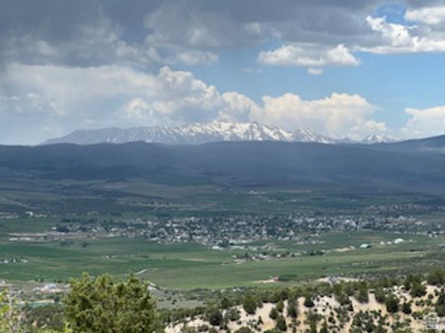 Breathtaking, panoramic views of Mt. Pleasant, Fairview, and the majestic Mt. Nebo from this exceptional, ready-to-build lot. Perfectly positioned to capture stunning, unobstructed scenery in every direction, this property offers the ideal setting for your dream home or a peaceful mountain retreat. Endless recreational activities including hiking, mountain biking, four wheeling, dirt biking, and more, plus nearby lakes, fishing, hunting, rock climbing, etc. In the winter, access is by snowmobiles or other tracked vehicles. The mountain air is the best. Close to grocery stores, pharmacy, restaurants, Drive-in theater and other amenities. Extensive groundwork has already been completed, saving you both time and money. Driveway has been cut in with a functioning culvert provides easy access, while the homesite has been cleared, leveled, and prepared for lots of parking space.  Utilities are already in place for your convenience-the water meter has been installed (a significant cost savings), and both the water line and power conduit have been run directly to the homesite, with power stubbed at the front of the lot.  With over $20,000 in improvements already completed, this property is truly turn-key and ready for your vision.