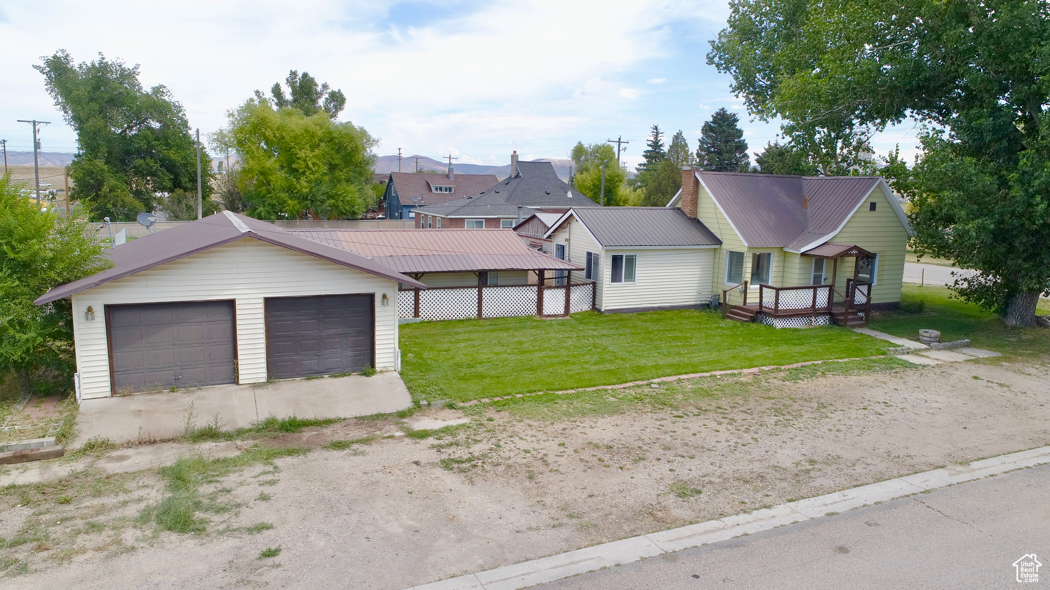 ANOTHER $10K PRICE DROP!! This Quaint Country Home is Calling Your Name! If You've Been Searching for An Affordable Home with a Lot of Shop Space, Storage Space, and Parking Space Then THIS is The Home for You! Featuring 2 Beds, 1 Bath, a Large Living Room with an Archway Leading into the Dining Room, Separate Laundry Room, and Lots of Space for Storage in the Basement. One Room is Being Used as a Living Space but Could Easily be Used as a Large Master Bedroom with a Separate Entrance. The Detached Heated Garage Offers Space for 4 Cars and A Workbench for Projects. Connected to the Garage is an Additional Large Storage and Workshop Area. The New Sod is Growing Well in the Yard, the Backyard is Completely Fenced so it's Ready for Your Pets, and You'll Already Have an Operational Chicken Coop! Additional Parking Space West of the Garage Would Be Great for Extra Storage Space as Well. Call Listing Agent Today to Schedule Your Private Showing.