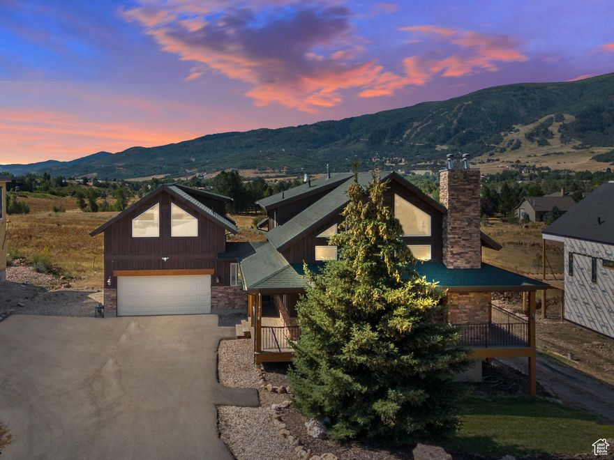 Discover unmatched flexibility and timeless mountain charm in this beautifully crafted home in The Preserve - just minutes from three major ski resorts, hiking and biking trails, boating, golfing, and more. This home offers three separate lock-off areas with their own private entrances - perfect for generating rental income, hosting guests, or multi-generational living, or enjoy the entire space as a single-family retreat. Inside, you'll find vaulted plank ceilings, rich hardwood flooring, and abundant natural light through large windows framing sweeping mountain views. The main-level primary suite offers a cozy fireplace, jetted tub, double-wide shower, and private covered deck with views of Nordic Valley Ski Resort. Upstairs includes a lofted family room, two bedrooms, and a full bath. The finished lower level offers a full kitchen, living area, bedroom, bathroom, and walk-out access - ideal as a private apartment or entertainment space. Above the detached two-car garage, a charming studio apartment features its own kitchenette, bathroom, and living area. The Preserve community offers a park, playground, bowery, and scenic paved trails along the North Fork seasonal river. Whether you're seeking a year-round residence, vacation retreat, or investment opportunity, this home delivers endless possibilities - all set against Utah's most spectacular mountain backdrop.