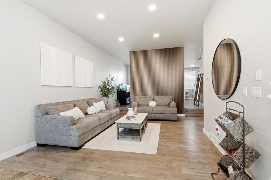 This exceptional home offers the perfect blend of convenience and elevated lifestyle. Enjoy walkable access to shops, dining, parks, trails, and all the amenities that make Daybreak one of Utah's most sought-after communities. Step inside to an exquisite main living area featuring soaring tall ceilings and an abundance of natural light that creates an open, airy feel throughout. The thoughtfully designed floor plan is both unique and highly functional - offering defined spaces without sacrificing flow, ideal for both everyday living and entertaining. The massive primary suite is a true retreat, providing generous space, comfort, and privacy rarely found at this price point. Every detail of this home has been curated to maximize livability while embracing the vibrant Daybreak lifestyle. Ideally located just minutes from Downtown Daybreak and within close proximity to TRAX, this is the one that stands out. Make it yours today!