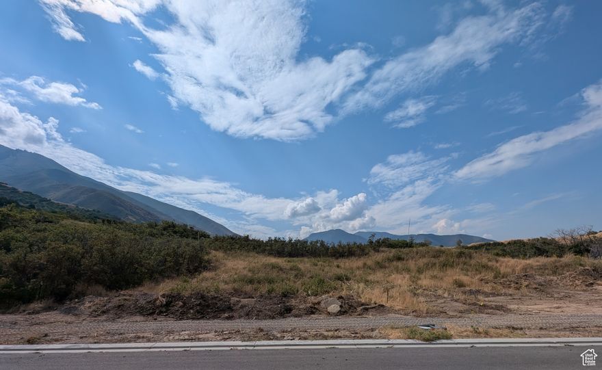 Nestled in the coveted Hidden Hollow Cove community, this Mapleton lot offers an exceptional opportunity to build your dream home. The land is priced below comparable properties, offering exceptional value in one of Mapleton's most desirable neighborhoods. Situated alongside dedicated, tree-covered open space that will include a beautiful walking trail, this lot provides unique natural privacy and seclusion. Hidden Hollow Cove features upscale homes, mountain views, and access to parks, schools, and outdoor recreation, an ideal setting for those looking for both community and quiet surroundings.  All information is deemed reliable but not guaranteed. Buyer to verify all details, including square footage and lot size, to their own satisfaction.  The seller and broker comply with all Fair Housing laws. This property is available to all persons regardless of race, color, religion, sex, handicap, familial status, or national origin.