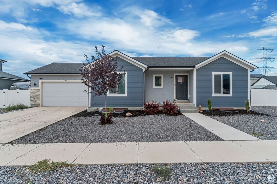 Stunning New Mountain View Home in Eagle Point with NO HOA!! Welcome to Narwhal Homes' Sea Horse floor plan, a thoughtfully designed residence offering just over 2500 square feet of potential living space with unbeatable mountain views. Nestled in the sought-after Eagle Point subdivision, this 2023-built home blends modern finishes with comfortable design, creating the perfect balance of style and function. Step inside to find 1,250 square feet on the main floor, where vaulted ceilings, double-pane windows, and an open layout fill the home with natural light. The primary suite features a spacious walk-in closet, a spa-like bath with a separate tub and shower, and elegant finishes designed for relaxation. Two additional bedrooms, a full bath, and a convenient laundry room complete the main level - making everyday living simple and seamless. The unfinished basement provides over 1,200 square feet of expansion potential, with space for a large great room, three bedrooms (two are already completed), and a full bath - perfect for customizing to fit your lifestyle. Situated on a 0.20-acre flat lot, this home offers landscaped front yard, curb and gutter, sidewalks, and stunning mountain views right from your doorstep. The exterior blends stone, stucco, and cement board siding for timeless curb appeal, complemented by a two-car attached garage and generous storage space.  Eagle Mountain is one of Utah's fastest-growing communities, celebrated for its stunning natural surroundings, friendly neighborhoods, and outdoor recreation. Whether you're hiking local trails, exploring nearby parks, or enjoying the convenience of new schools and shopping, this location has it all. With breathtaking mountain views and a vibrant community spirit, Eagle Mountain offers the perfect place to call home.