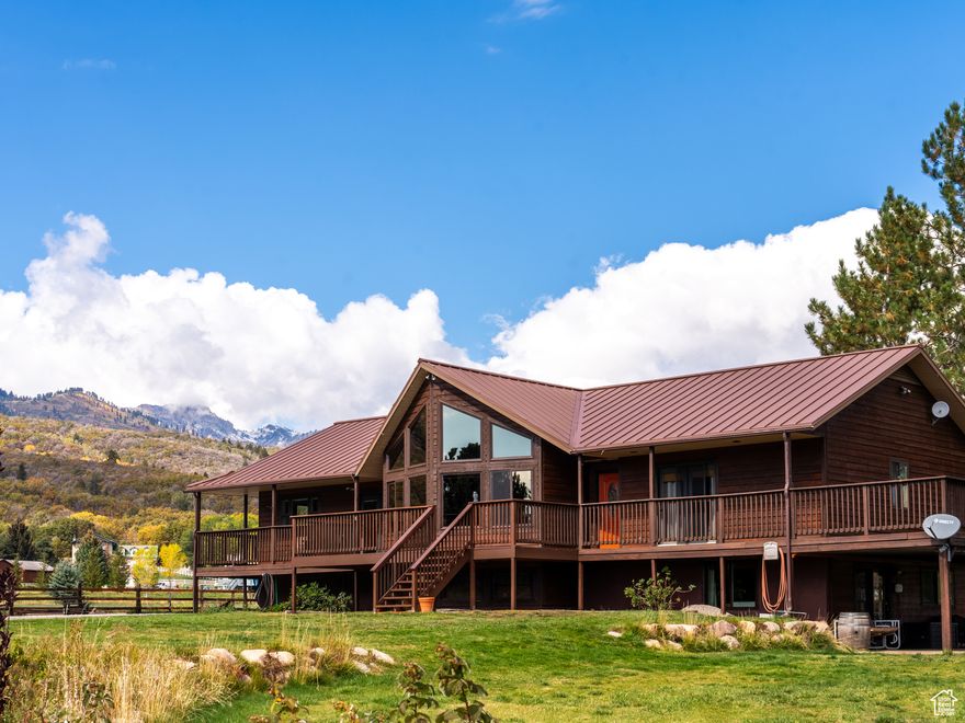 Set on 6.45 acres in Ogden Valley, this light-filled alpine-modern retreat delivers privacy and convenience minutes from Nordic Valley and Powder Mountain. A vaulted great room wrapped in tongue-and-groove wood and a dramatic wall of windows frame sweeping valley and hill views. The main level flows from a cozy living area with a gas fireplace to a generous dining space and island kitchen with gas cooktop, plus a spacious en-suite primary with walk-in closet and jetted tub, a dedicated office, full bath, and laundry.  The bright walkout lower level-with private entrance-adds two large bedrooms, a full bath, second laundry, movie room, and an expansive family room, creating easy options for guest quarters, a home office/studio, or a future apartment. Wraparound decks catch sunrise and sunset, while level grounds invite outdoor living with a fire pit, gardens, and approximately 5 acres of pasture for grazing, hay production, and riding. Zoned for livestock and horses with potential greenbelt status.  Equestrian facilities include a 120'60' indoor arena attached to a 120'24' barn with 4 stalls (expandable to 7), space for hay storage, future tack room, and wash rack; outlets are set for heated buckets, with LED lighting and an electrical panel. The barn aisle has 10'9' overhead doors at both ends; the arena offers 12'16' doors for easy access. Additional outbuildings feature a 31'60' shop with two 10'12' overhead doors, mezzanine above two stalls, tack storage, LED lights, and its own panel; and an oversized 36'36' heated garage with two 16'10' overhead doors and an attached lean-to for parking or extra stalls. Two exterior RV outlets (30-amp and 50-amp) support trailers and recreational vehicles.  The property is fully irrigated with secondary water (hand lines and irrigation wheel), and the yard is sprinkled on secondary. Minutes to skiing, scenic trailheads, and Pineview Reservoir-this is a rare four-season basecamp where nature, recreation, and comfort meet. All property information, boundaries and documents to be verified by buyer.