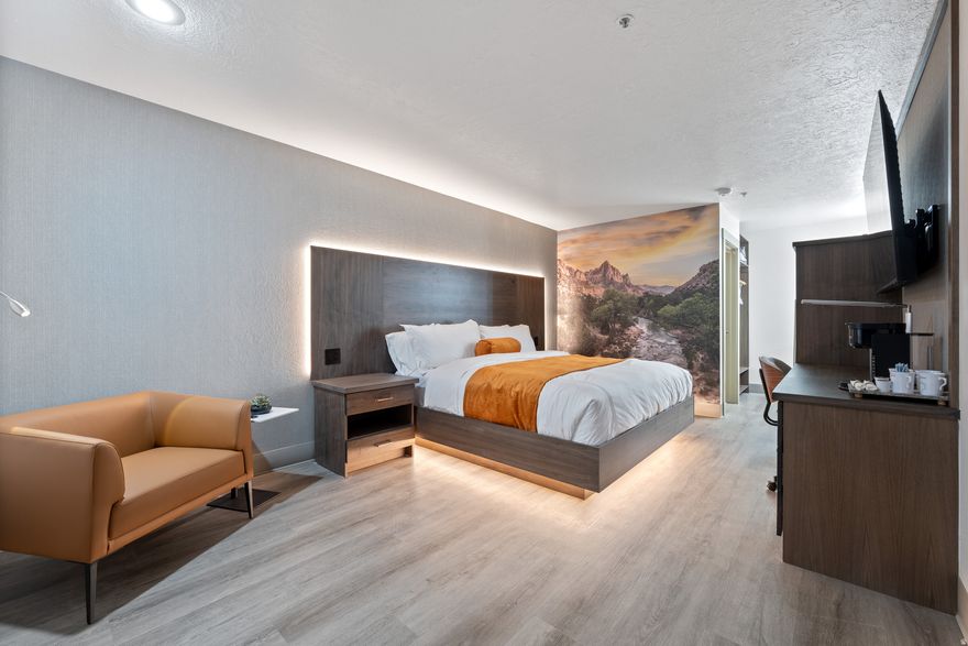 Own a City View or Pool Side Condo-hotel unit in one of St. George's busiest and most desirable districts, drawing year-round tourism and tournament traffic. Ideally located within the Promenade Shopping Center, adjacent to I-15 Exit 8 and directly across from The Shoppes at Zion, this property offers exceptional visibility and accessibility. The hotel is undergoing a full redesign and renovation with upgraded resort-style amenities. Enjoy a private outdoor pool, hot tub, fire pits, BBQ's and enhanced privacy with the raised east wall surrounding the pool area. Additional amenities include guest laundry facilities, business center, complimentary breakfast, and WiFi. Each unit includes standard hotel features such as a flat-screen TV, table and chair, coffee maker, microwave, refrigerator, hair dryer, iron and ironing board, with select connecting rooms. Condo owners also enjoy access to an exclusive owners lounge during their stay.