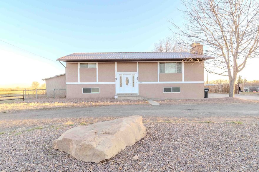 Situated on nearly 4 acres in the heart of Duchesne County, this split-entry home delivers the space, privacy, and functionality that make rural Utah living so appealing. No HOA. No flood zone. Just land and lifestyle. Inside you'll find a well-maintained home with a cozy fireplace, updated flooring, fresh paint, and newer fixtures and appliances throughout. The finished basement expands your living options significantly, whether you need extra bedrooms, a recreation room, dedicated storage, or all three. Step outside and the property truly shines. A large outbuilding/barn of approximately 2,000 sq ft provides exceptional utility for equipment, livestock, storage, or a workshop. A two-car carport, gravel driveway, and spacious rear deck round out this hard-working, versatile property. Conveniently located just minutes from Roosevelt's shopping, dining, and services with easy access to US-40. Vernal is also within comfortable commuting distance and schools and parks are all close by.
