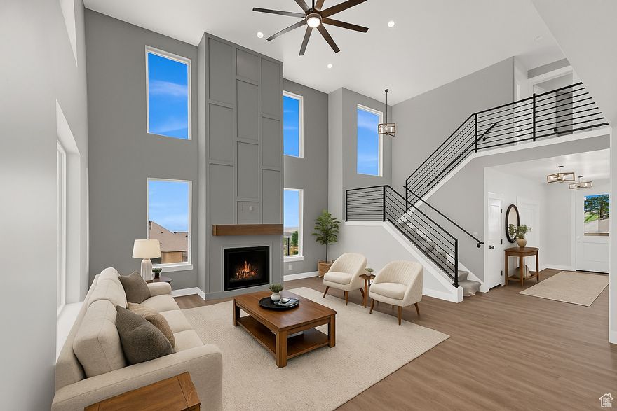 This Move-in Ready home blends elegant design with functional living. The striking rock and Hardie exterior sets the tone for the thoughtfully designed interior, where a gourmet kitchen boasts soft-close cabinets, high-end stainless steel appliances, granite or quartz surfaces, and a hidden walk-in pantry. The main floor includes a private office, upgraded laminate flooring, and rich two-tone paint. Retreat to the expansive owner's suite with a soaking garden tub, designer shower, and walk-in closet. Outdoor features include a covered 10x14 deck, an oversized 3-car garage with an EV charger and a walk-out basement room for an ADU. **Offer written before Oct. 15 will receive landscaping credit, basement finishes or $15,000 towards Buyer's closing cost.**