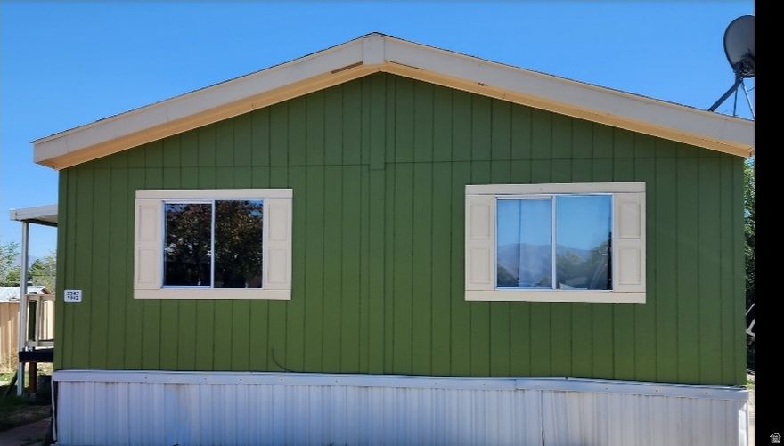 Check out this lovely Double-wide! Move-in ready! Across the street from visitor parking and swimming pool! Entertainment, shopping and Bangerter highway are just a turn away! Sq Ft provided as a courtesy measurement only. Buyer/Buyer Broker to verify all info.