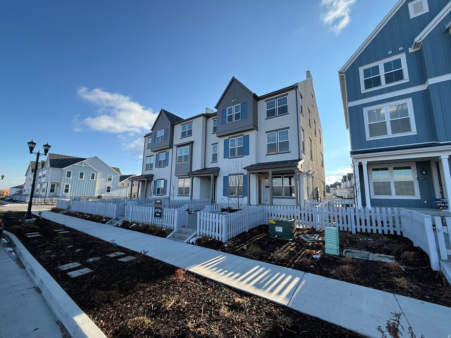 beautiful three story home with a spacious family kitchen dining. This home is located on an amazing lot located right next to the Daybreak mountain bike course, with great views of the mountains.