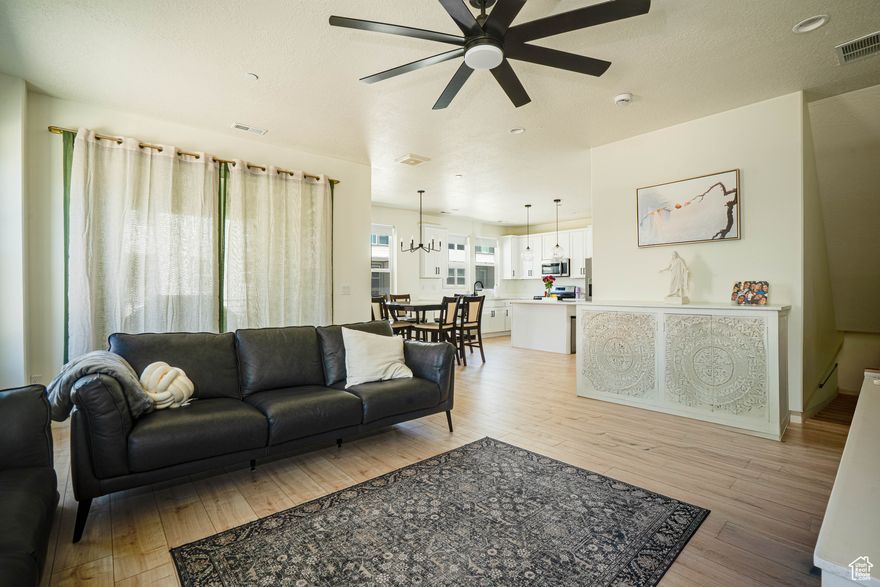 What a great location! This beautiful home boasts of a prime location and a welcoming atmosphere that you'll love coming home to everyday! Super close to Station Park, Harmons, restaurants, shopping, concerts, etc.! This home showcases exceptional design and modern finishes. Don't need to equip this home with the typical expenses that come from buying a new construction. This home already comes equipped with nice window shades, fans, appliances, etc. Walk out to your deck for relaxation, entertaining guests or just enjoy the quite evenings with loved ones. A lot of natural light floods the space with big windows in every room. Additionally, Ivy Acres Park is being built very close and it'll be a great plus to this location! It'll have playgrounds, log obstacle course, slides, climbing nets, and more! Welcome to your new home! (Information deemed reliable and provided as a courtesy. Buyer and/or buyer's agent advised to verify all information provided including city project of Ivy Acres Park)