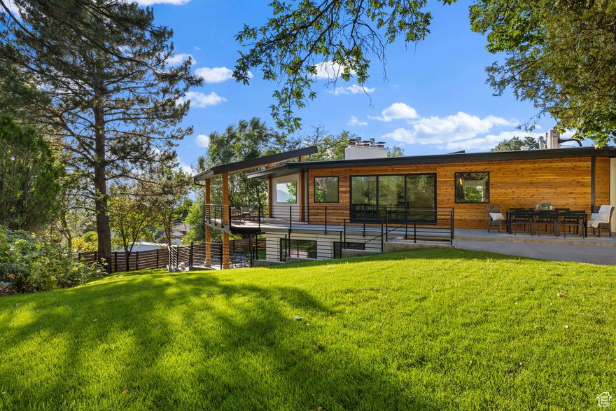 *** BELOW MARKET FINANCING INCENTIVES AVAILABLE WITH PREFERRED LENDER *** Timeless Structure. Contemporary Luxury. A Rare Retreat on a Secluded, Wooded Lot Bordering a Preserved Native Forest.*** This reimagined residence provides a rare opportunity to own a nearly new home that seamlessly blends modern elegance with enduring architectural strength. Under full municipal inspection, every surface, system, and finish has been replaced, refined, and rebuilt with a focus on craftsmanship, quality, and timeless design. Most of the living area is above grade, welcoming abundant natural light and offering elevated views throughout the home. The transformation of this home was executed with precision and purpose. Five generously proportioned bedrooms and three and a half thoughtfully appointed baths strike a refined balance of comfort, functionality, and understated elegance. The interiors are suitable for both intimate living and large-scale entertaining. A chef's kitchen is the centerpiece of the main level. It features custom cabinetry, a pot filler, and high-end appliances. These include professional-grade Monogram appliances and a beverage fridge. The spacious and hidden butler's pantry has a second dishwasher and ample prep space, making hosting and cooking simpler. Located near the garage, a generous mudroom provides additional storage and practical organization. Many premium systems and finishes carry long-term warranties. A rare and distinguished opportunity for the discerning buyer-where architectural grandeur meets refined aesthetics, and luxury is designed to endure-schedule your visit now. Contact the listing agent today to secure your private tour and learn about the exclusive lender incentives. Square footage figures and property details are provided as a courtesy.