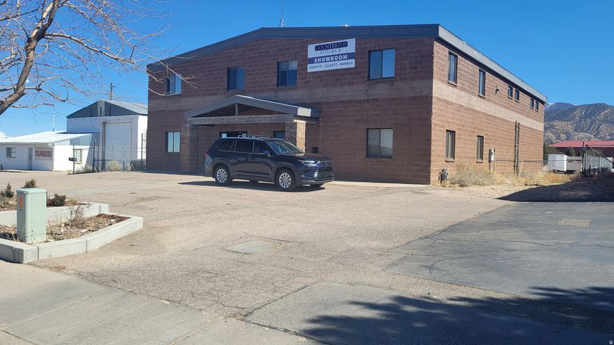 Prime Flex-Industrial Near Cedar City Airport! Unlock the perfect HQ for your business! This 6,156 sq. ft. flex building combines a high-performance warehouse with a massive 2-level professional office suite. 6,156 total sq. ft. on a .52-acre fenced lot. 8 Private Offices, 5 Bathrooms, Conference Room, and 2 Reception areas. Approx 3,000 sq. ft. warehouse/garage with grade-level loading. & ample parking for crews and clients. These numbers are based off of all total sq. footage, Minutes from I-15 and the Cedar City Regional Airport. Zoned I&M-1 (Light Industrial) - ideal for contractors, light manufacturing, or regional service hubs. Don't miss one of the most functional layouts in Southern Utah!