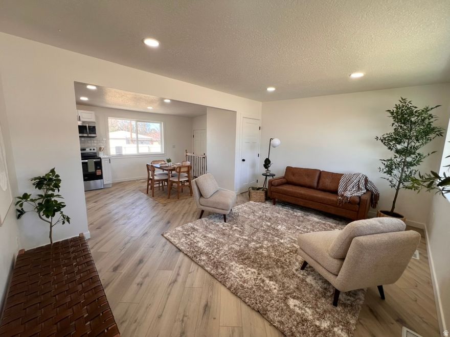 Can you imagine not having to worry about any maintenance for years to come on your beautiful new home right when you move in? This home has been meticulously renovated from top to bottom. It can be amazing for anyone living up or down with your own kitchen, laundry, and great room on each floor. This home has a new roof, HVAC, electrical and plumbing. All of the flooring, finishes, hardware, buiding materials, and design are of the highest quality and style. The main level floors had all sub flooring replaced as well as drywall and added new higher rated insulation throughout. The bathrooms have all been made more spacious, who wants to knock there knees on the tub while you are sitting on the throan. All new sprinklers with new grass on auto boxes for ease of use for a beautiful yard all year round. All updates completed with permits and will be shared through your sellers disclosures. For someone that wants to live/rent there is an easy option to add a wall to separate the two levels and have two secured entrances. Inquire for builder details.  This can easily become an amazing investment if you'd like to someone else to pay your mortgage while you are living under the same roof. This home was intended for someone to love where they live.