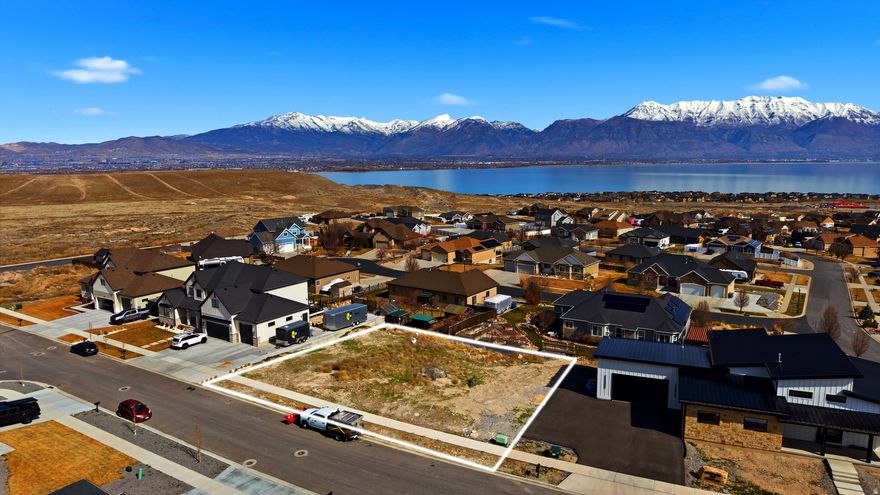 Located in the highly sought-after Jacobs Ranch subdivision, this spacious 0.27-acre lot offers stunning views of the mountains, valley and Utah Lake. With all utilities stubbed and no HOA restrictions, it's the perfect site to create a custom home in a peaceful, established neighborhood. Just minutes from schools, parks, shopping and hiking trails, opportunities like this are rare!