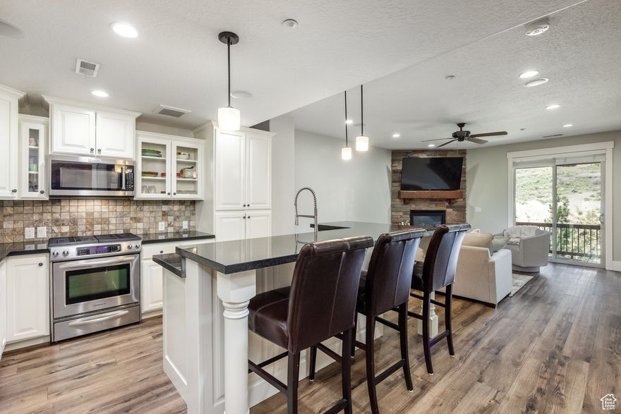 Live large with pool, hot tub, fitness center, clubhouse, picnic tables, dog park and walking/bike path included as part of your $390/month HOA dues or hop on the adjacent trail system for access to all Park City offers. Want to rent out the property when you are not using it? No problem! This stylish 3-bedroom, 3-bath townhome is designed for effortless mountain living. The open floor plan, updated with hardwood flooring and a new roof, flows seamlessly from the gourmet kitchen-featuring granite countertops and stainless appliances-to the sunlit living spaces. The spacious primary suite includes a flex room, ideal for a home office, gym, or nursery. A full-length driveway and 2-car garage offer rare convenience. Enjoy the fresh mountain air from your patio or deck. Walk to the Overlook Restaurant & Bar or drive 5 minutes to Jordanelle State Park and Deer Valley East Village via the Jordanelle Parkway. Whether you're seeking a full-time residence or vacation retreat, this low- maintenance townhome delivers the best of Park City living. There is only one stoplight to Kimball Junction and the Salt Lake International airport!