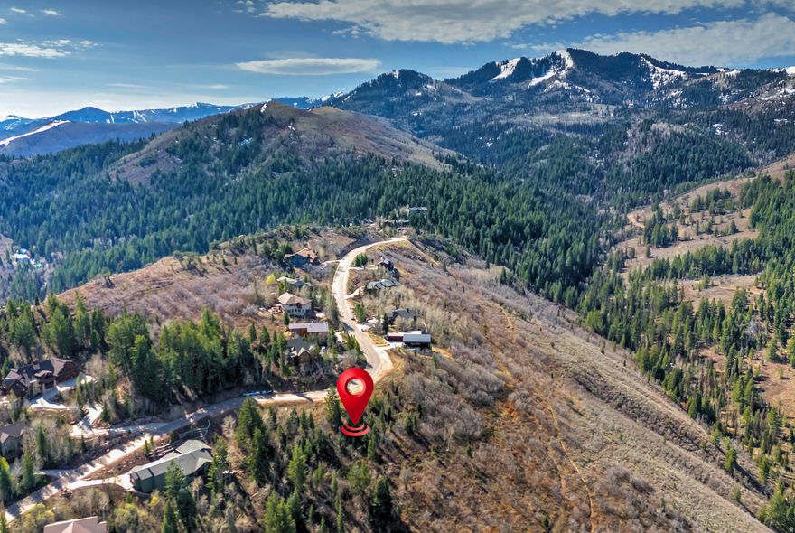 Nestled in the mountains, this homesite captures the essence of Pinebrook and the Park City lifestyle. Set within a scenic mountain valley, this parcel offers a sense of privacy and tranquility while still being part of a welcoming, well-connected community. Just minutes from everyday conveniences including grocery stores, dining, schools, parks, and trails, this location offers a rare balance of accessibility and seclusion allowing you to enjoy peaceful mountain living. Ideally situated minutes from Kimball Junction and Historic Main Street Park City, and just 30 minutes from Salt Lake City International Airport, the property provides effortless access to both recreation and travel. Approved HOA building plans are included for a thoughtfully designed 4,000 square foot residence, offering a streamlined path to building your mountain retreat while maximizing the potential of this exceptional homesite.