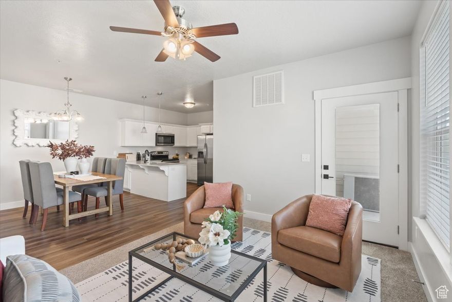 Welcome home to comfort, convenience, and style in this beautifully designed 3-bedroom, 2-bath modern condo! Built in 2020, this home offers 1,272 square feet of light-filled living space designed with an open-concept layout that seamlessly accommodates both lively gatherings and peaceful everyday living. The condo has all new luxury laminate flooring and carpet throughout and one of the nicest condos on the market!  The vast laundry room, pantry, and storage space, gives you plenty of room for your belongings to be kept organized. Step into the kitchen, where white shaker cabinets and sleek quartz countertops create a sophisticated atmosphere. Condo has new water softener, new dishwasher, disposal and kitchen faucet. With ample prep space, it's the ideal setting for entertaining friends or enjoying intimate dinners. Transition effortlessly to your covered patio, and relax with mountain views enjoy your casual summer grilling spot. This condo has been well cared-for and it shows!  Additional highlights include a private garage with a full driveway, a spacious primary suite with an ensuite bath, and all appliances are included with the sale. Residents have access to the community clubhouse, pool, and playground, and the location is convenient to shopping, dining, and transportation routes. Whether you are looking to downsize, invest (long-term rentals allowed), or purchase your first home, this condo offers low-maintenance living with modern features.  ** Listing Incentive: Receive a free 1-0 buydown, giving you a 1% lower interest rate for the first year. Incentive offered by Nikko Denis at Intercap Lending. Terms and conditions apply. Buyer must qualify. Rates subject to change without notice.**  Call us today to schedule your showing!