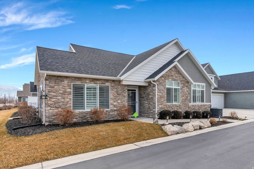 Live the lifestyle you've been waiting for in the heart of Saratoga Springs. This immaculate, single-level home in a vibrant 55+ community offers comfort, convenience, and community all in one.  Inside, you'll love the thoughtfully designed floor plan featuring a spacious kitchen with island bar, ample cabinetry, and plenty of counter space. The family room with cozy gas fireplace creates the perfect gathering space, while the semi-formal dining area opens to a charming fenced patio for easy indoor-outdoor living.  The primary suite is a peaceful retreat with a separate tub and shower and walk-in closet. A generous second bedroom with custom closet, full bath, plus a flex room perfect for an office, formal area, guest area, hobbies, or workspace. Plantation shutters add an upscale touch throughout.  The garage features an impressive built-in storage room with plenty of space for organized storage. Enjoy low-maintenance living and resort-style amenities including a clubhouse, pool, fitness center, and a movie theater area with films every Friday night.  Move-in ready and beautifully maintained-this one truly stands out.