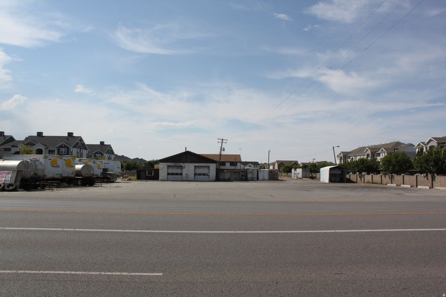 Prime 2.3-Acre Commercial Development Site in High-Growth Corridor Outstanding opportunity to acquire a 2.3-acre site in the heart of a rapidly transforming area surrounded by new retail, office, and multifamily development. With new apartment communities on both sides, this property sits in the middle of strong demand and continued growth. The site includes a 4,136 SF warehouse suitable for immediate flex-industrial use, featuring overhead garage doors, garage space, office build out, and restrooms on both levels. City road frontage and access on both sides of the property provide exceptional flexibility for operations or future redevelopment. This is a land-value play with significant upside. Zoned Commercial. Some environmental remediation may be required for commercial redevelopment.  More extensive remediation would be required for multifamily redevelopment, with higher associated costs. Details available upon request. Zoned Commercial, the property offers rare scale, location, and access in an area where developable land is increasingly scarce. Ideal for investors, developers, or owner-users looking to capitalize on the momentum of this corridor.