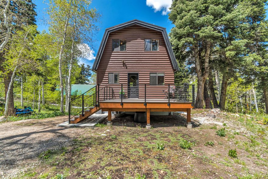 Updated, knotty pine cabin on the upper mountain in theTimber Lakes private community .Surrounded by mature aspen trees and evergreens, and frequent moose, deer, and much more wildlife. Ride snowmobiles, ATV, or hike out directly from your new home into the Uinta National Forest. Enjoy fast and reliable FIBER INTERNET ready to use immediately. Take advantage of this peaceful escape, with being only minutes from world class Skiing and golf in Heber/Park City.  Roof about 2 years old. Water heater 2 years old. Furnace 1 year old.