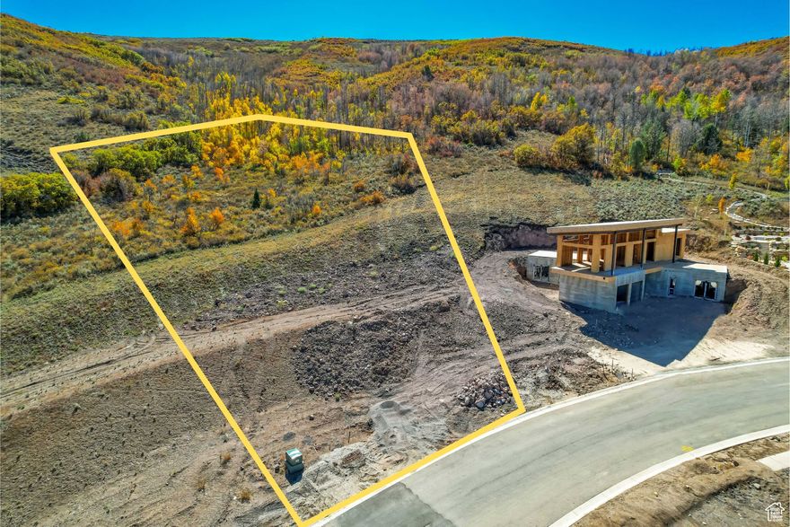 Set on more than an acre, this homesite offers the perfect backdrop for a custom mountain retreat. The property's generous size allows room for thoughtful design, including outdoor living spaces that take full advantage of the surrounding natural beauty. Situated close to the new East Village and the upcoming Tiger Woodsdesigned golf course, the location combines privacy with easy access to top-tier amenities. A convenient shuttle connects you to nearby ski resorts, making year-round recreation simple and seamless. With its stunning views and prime position, this lot is a rare opportunity to create a truly exceptional mountain home.