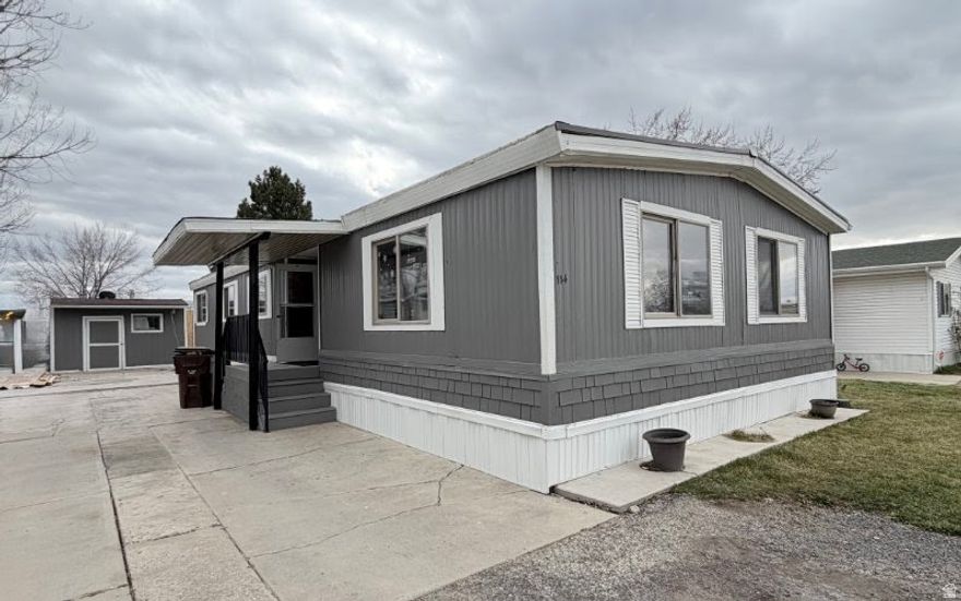 Spacious double-wide mobile home offering a great opportunity to build equity. Complete the remaining repairs and customize to your needs. The flexible floor plan allows for the potential to add a fifth bedroom or keep the space as a large den or home office. Rarely available with generous interior space and ample parking, plus room to enjoy both inside and out. Ideal for buyers looking for space, value, and future potential.