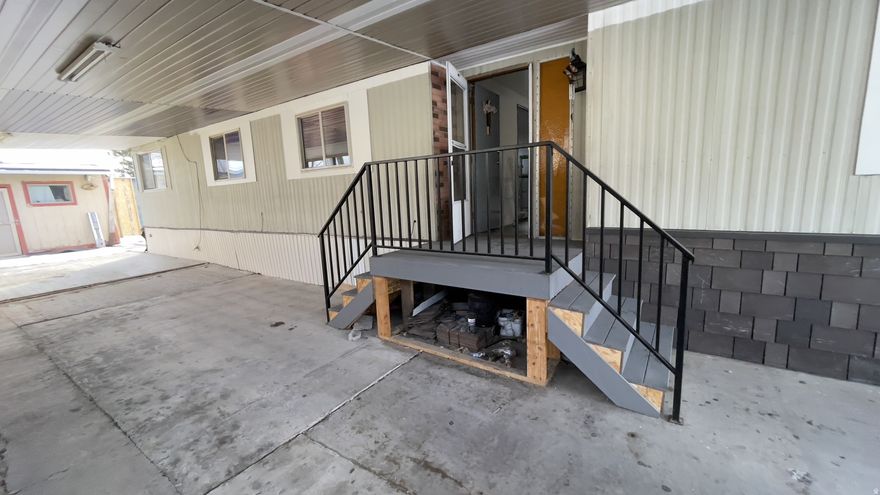 Spacious double-wide mobile home offering a great opportunity to build equity. Complete the remaining repairs and customize to your needs. The flexible floor plan allows for the potential to add a fifth bedroom or keep the space as a large den or home office. Rarely available with generous interior space and ample parking, plus room to enjoy both inside and out. Ideal for buyers looking for space, value, and future potential.