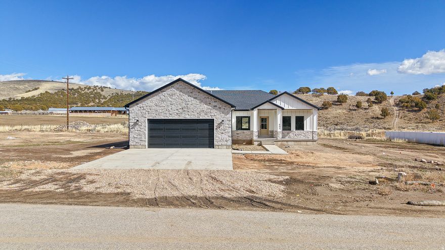 Brand-new custom home in Fountain Green featuring 3 bedrooms, 2 full bathrooms, and 3,400 sq ft of beautifully finished living space on a half-acre lot. This 2025-built home offers a stunning kitchen with high-end cabinets, upgraded appliances , custom railing, and premium flooring throughout. All appliances included for true move-in-ready convenience. The Primary bath has a separate tub and shower with custom tile throughout. The oversized 2-car garage provides ample storage and functionality. Quality craftsmanship and upgrades throughout with room to enjoy quiet small-town living.